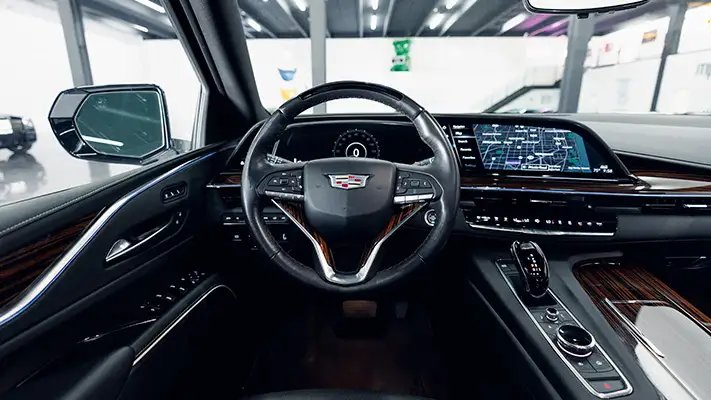 white-on-black-cadillac-escalade-rental-dashboard-view-turntable-mph-club