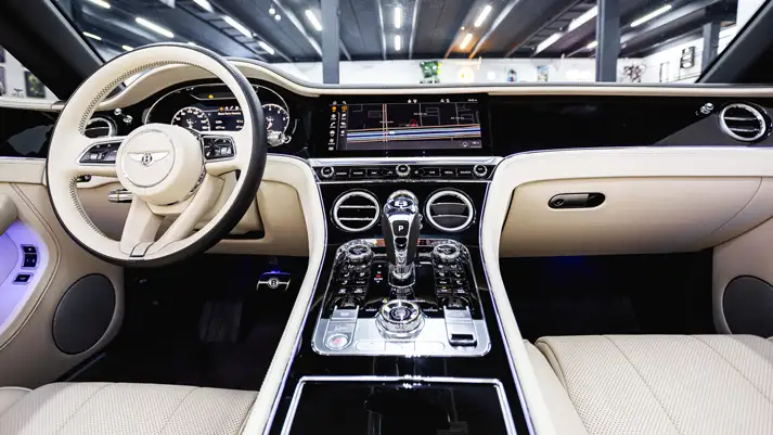 white-on-white-bentley-continental-gtc-rental-dashboard-view-mph-club